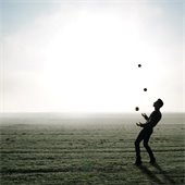 person juggling balls
