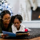 Two people reading a book