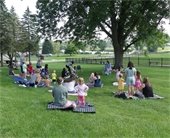 families enjoying outdoor storytime