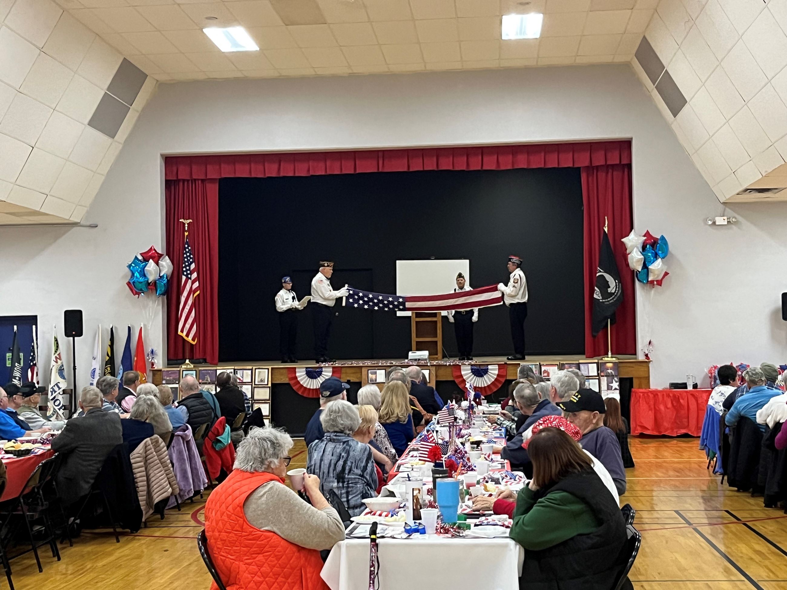 flag folding from the back of the room