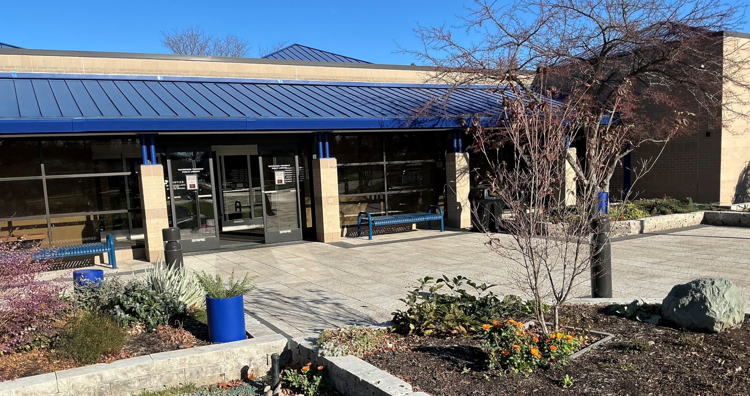 library front 2024 with beds and new pavers 