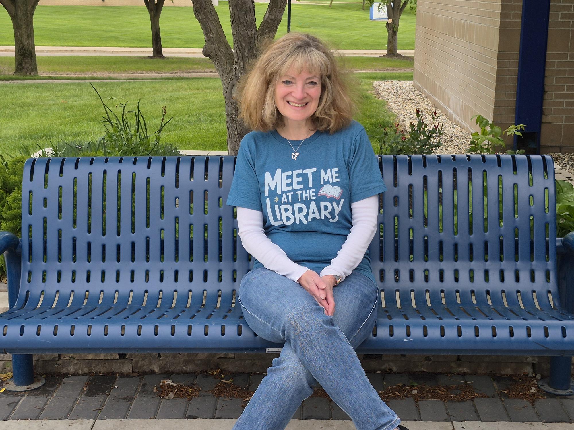Library Director, Julie Schaefer, on bench